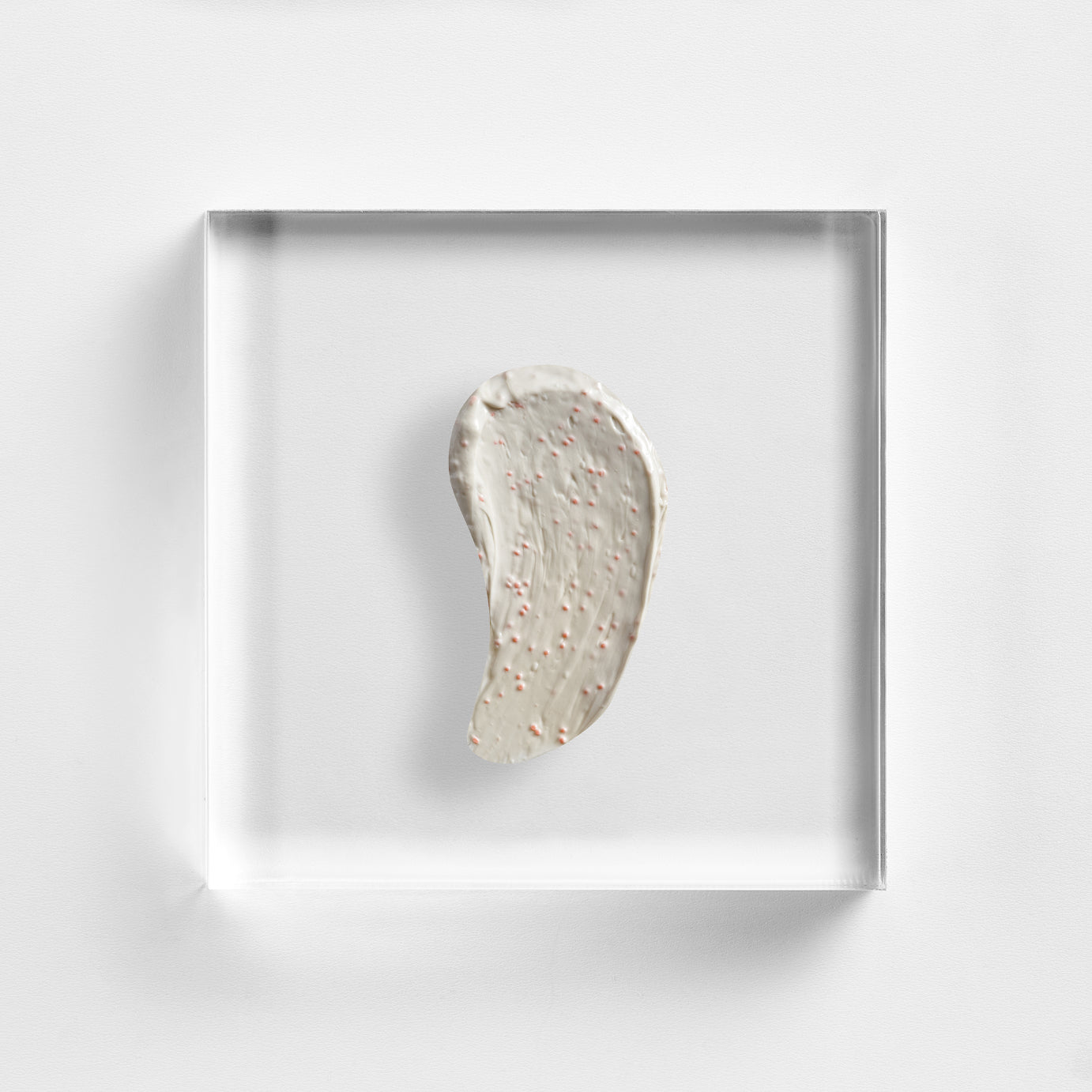 NEOVA 15-Minute Mask - texture image: a creamy formula with visible exfoliating beads on clear acrylic, highlighting its rich resurfacing texture.