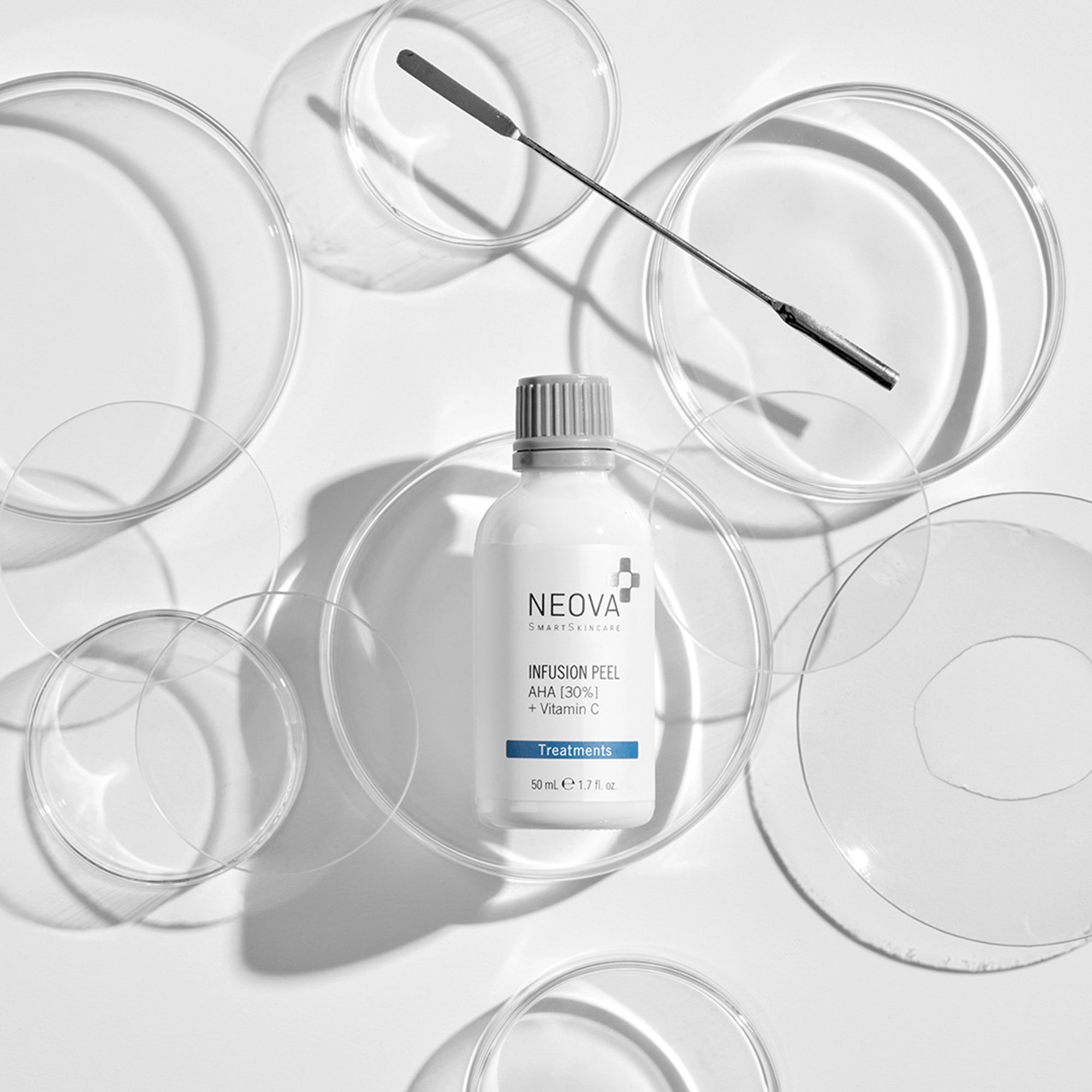 NEOVA About NEOVA - Image of professional chemical peel product, Infusion Peel with glass petri dishes and a metal stirring rod.