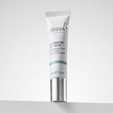 NEOVA Illuminating Eye Serum, a brightening eye serum with Copper Peptide Complex® that repairs skin at the DNA level, in a small, white cylindrical tube. The front label categorizes it under a blue "Prevention" banner. The squeeze tube, standing on a white ledge against a bright, clean background with soft shadows, has a brushed silver cap and contains 0.5 fl. oz. (15 ml).