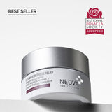 NEOVA Ultimate Redness Relief in a white glass jar. The label describes it as a "Repairing Complex with DNA Repair Enzymes + Copper Peptide Complex®" and categorizes it under a dark purple "Sensitive Relief" banner. The jar features a brushed silver screw cap. It is shown standing on a white surface against a clean, bright minimalist background. A black "Best Seller" tag is shown in the upper left corner. A red "National Rosacea Society Accepted" seal is shown in the upper right corner.