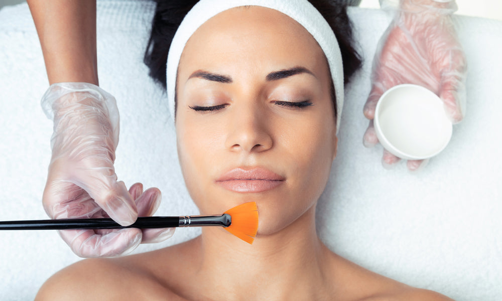 NEOVA - Chemical Peel - Woman in a med spa getting a professional chemical peel treatment applied to her chin.