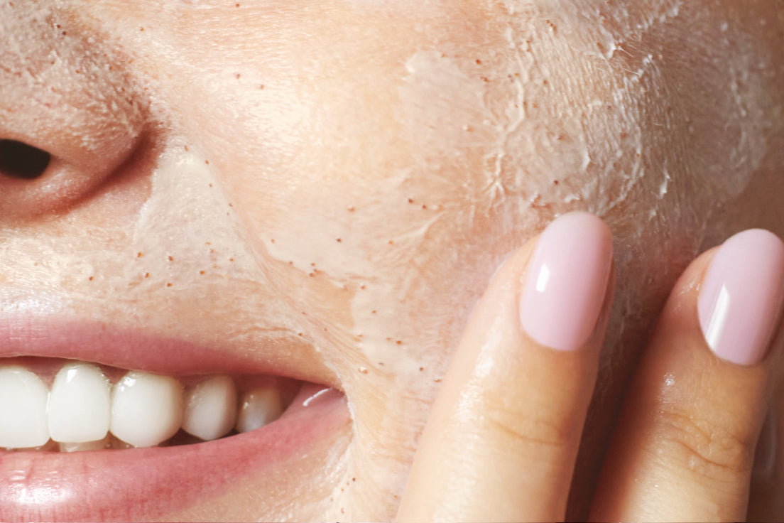 NEOVA 15 Minute Reset Mask – application: Close-up of cheek showing restorative face mask being applied to calm redness, refresh dull skin, and improve overall skin clarity.