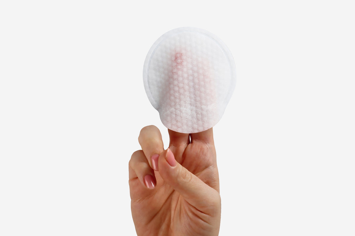 NEOVA Alpha Beta Retinol Science Image - Image of a cotton pad representing advanced alpha hydroxy acid, beta hydroxy acid, and retinol formulation for skin renewal.