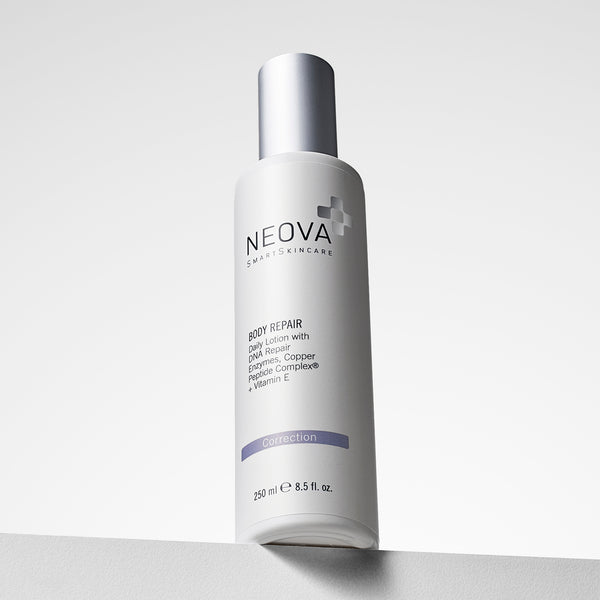 NEOVA Body Repair moisturizer in a tall, white cylindrical bottle. The front label highlights it is a Daily Lotion with DNA Repair Enzymes, Copper Peptide Complex®, and Vitamin E, and labels it with a purple "Correction" banner. The bottle has a brushed silver cap and contains 8.5 fl. oz. (250 ml). It is shown at a slight low-angle view on a white ledge against a bright, minimalist background.
