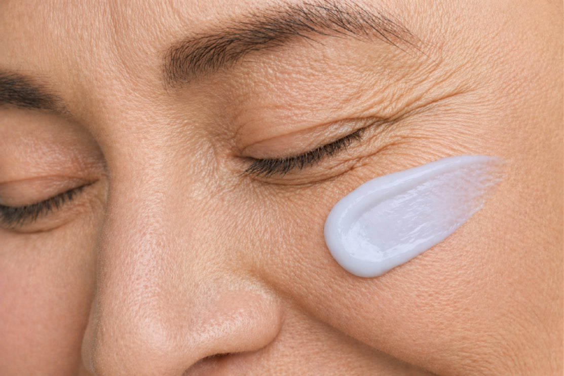 NEOVA Creme de la Copper – application: Close-up of cheek showing copper peptide cream being applied to support skin repair, improve elasticity, and reduce visible signs of aging.