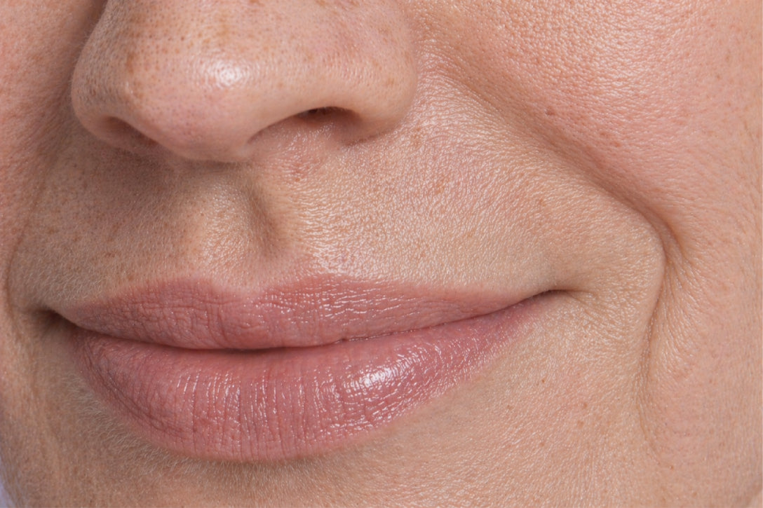 NEOVA CU3 Lip Repair – application: Close-up of lips showing reparative lip treatment being applied to hydrate, smooth dryness, and soften fine lines.