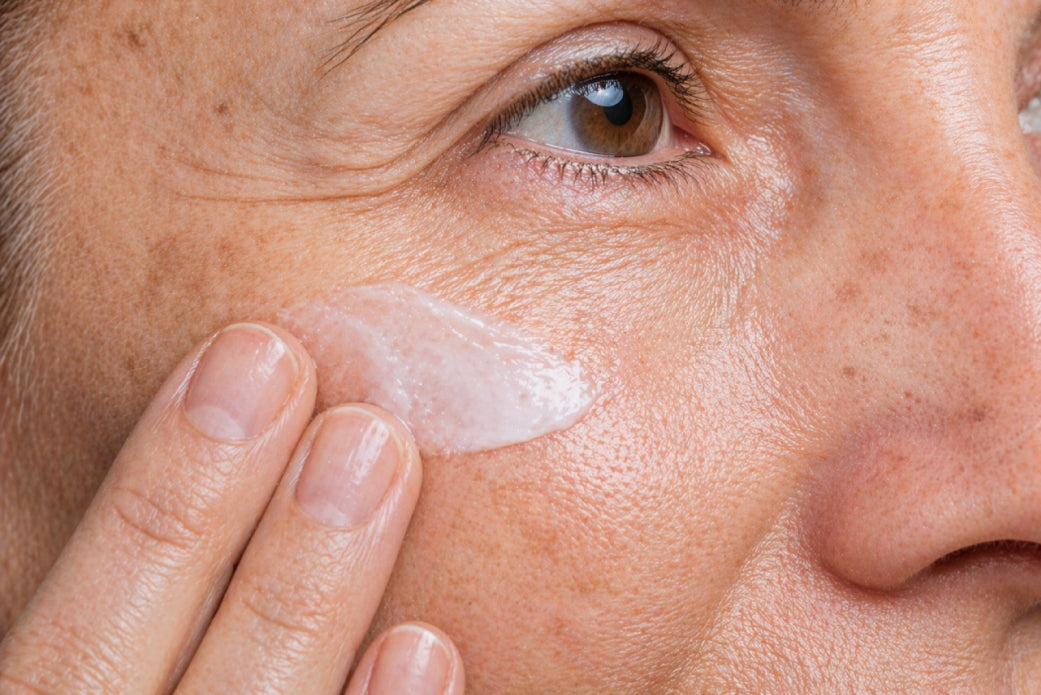 NEOVA CU3 Tissue Repair – application: Close-up of mature skin on cheek showing copper peptide cream being gently applied to target redness, irritation, and compromised skin barrier.