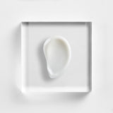 A rich texture swatch of Neova DNA Total Repair serum, showing the smooth consistency of the three-enzyme formula for skin recovery