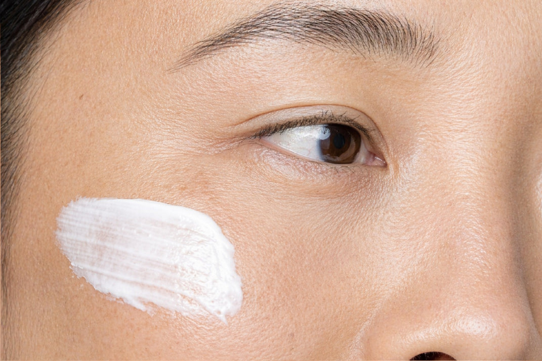 NEOVA Everyday – application: Close-up of face showing lightweight daily SPF moisturizer being evenly applied to support hydration, skin barrier function, and UV-damaged skin.