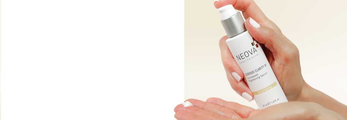 NEOVA - Fall Reset - Serious Clarity 4X - A hand holding a white bottle of NEOVA Serious Clarity 4X treatment serum with a silver pump, shown dispensing a small amount of the white serum onto another hand against a light beige background.