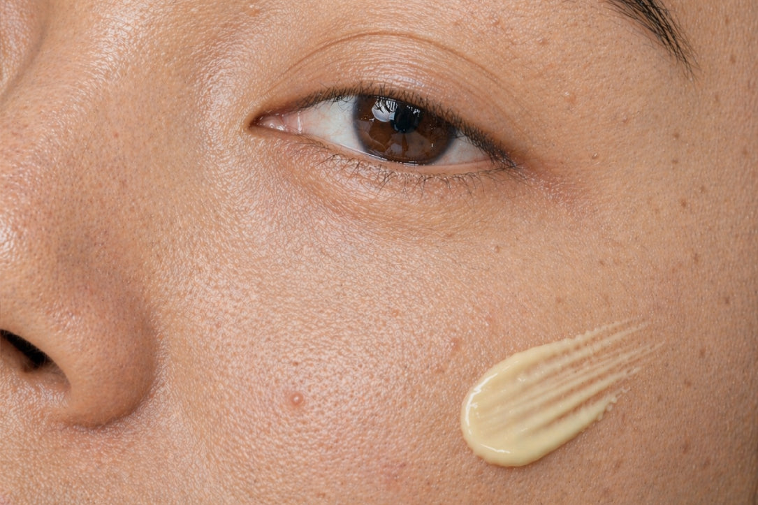 NEOVA Retinol Rapid TX – application: Close-up of cheek showing retinol treatment being applied to improve skin tone, reduce fine lines, and support smoother texture.