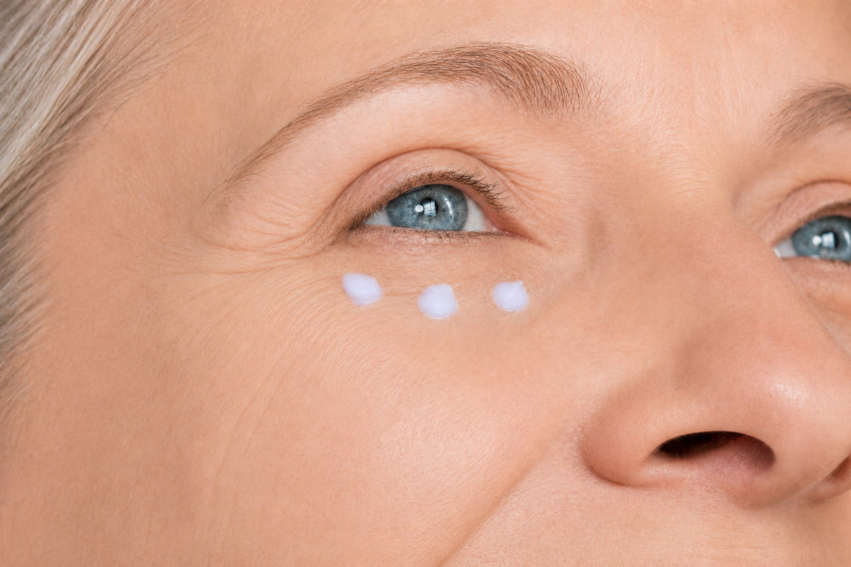 NEOVA Super Eye Lift Serum – application: Close-up of under-eye area showing serum being gently applied to improve firmness, reduce fine lines, and support a lifted appearance.