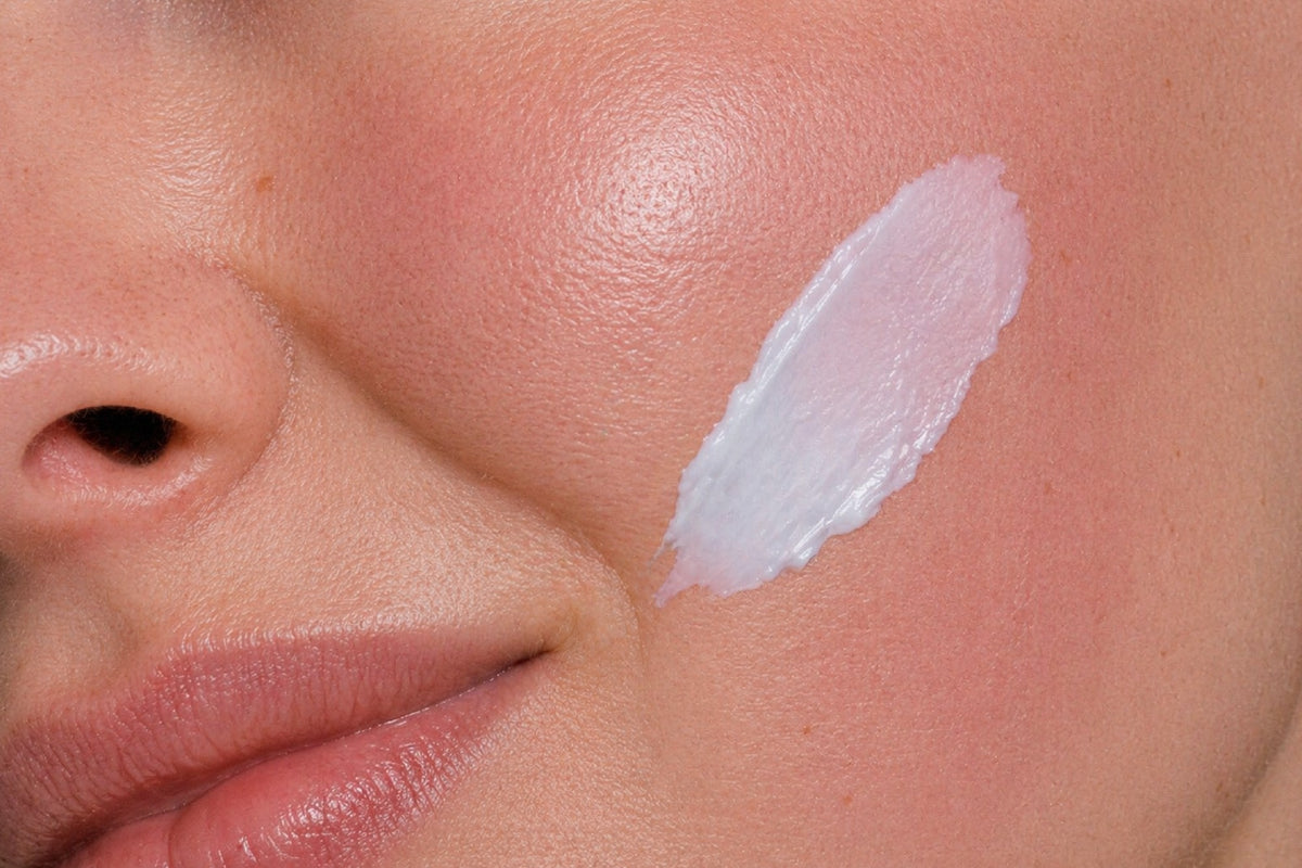 NEOVA Ultimate Redness Relief – application: Close-up of cheek showing soothing treatment being applied to calm visible redness, reduce irritation, and support sensitive skin.